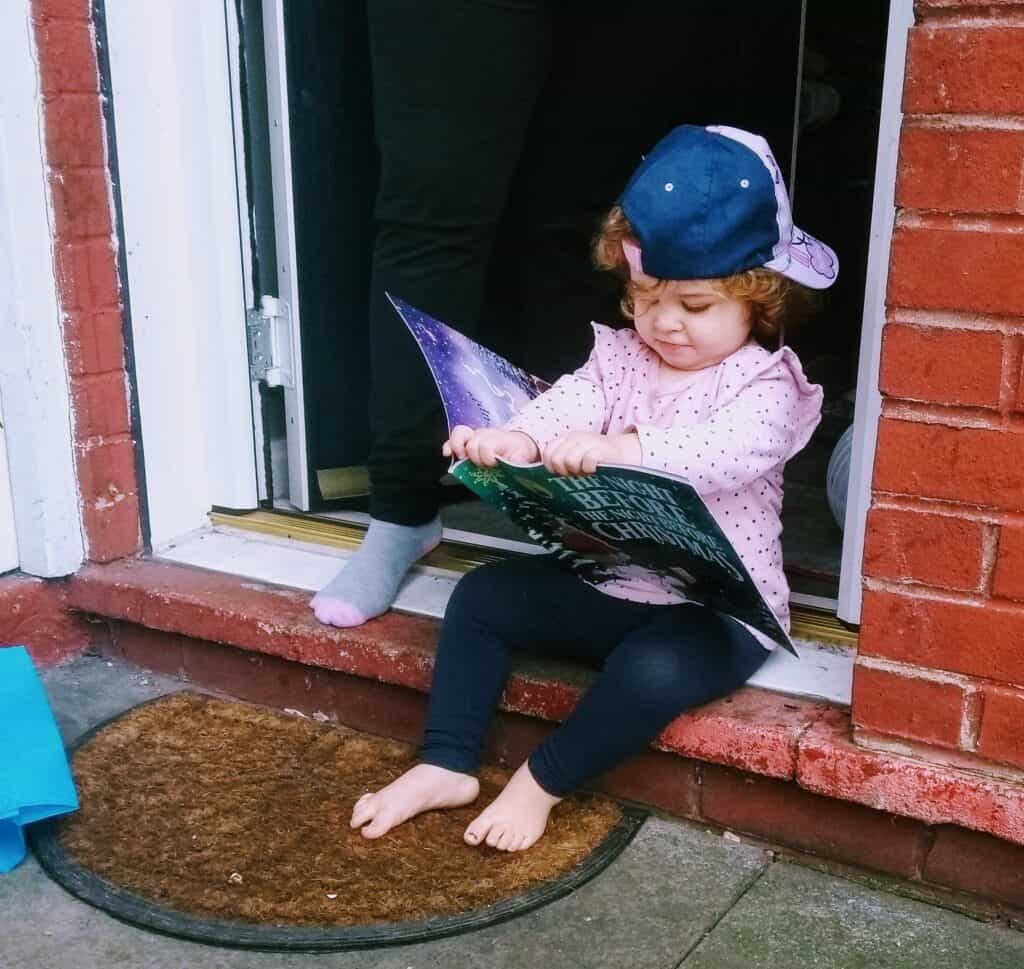 Toddler reading a book